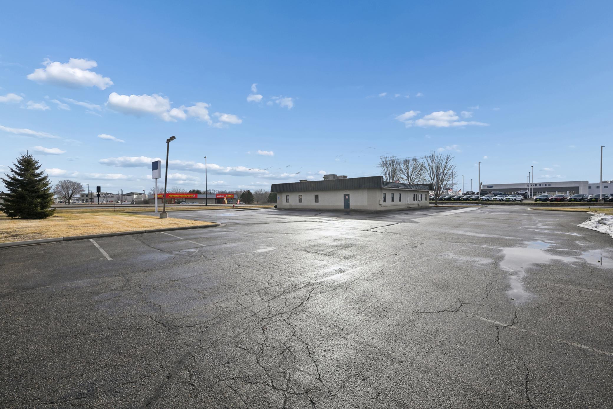Full view of the parking lot and building.