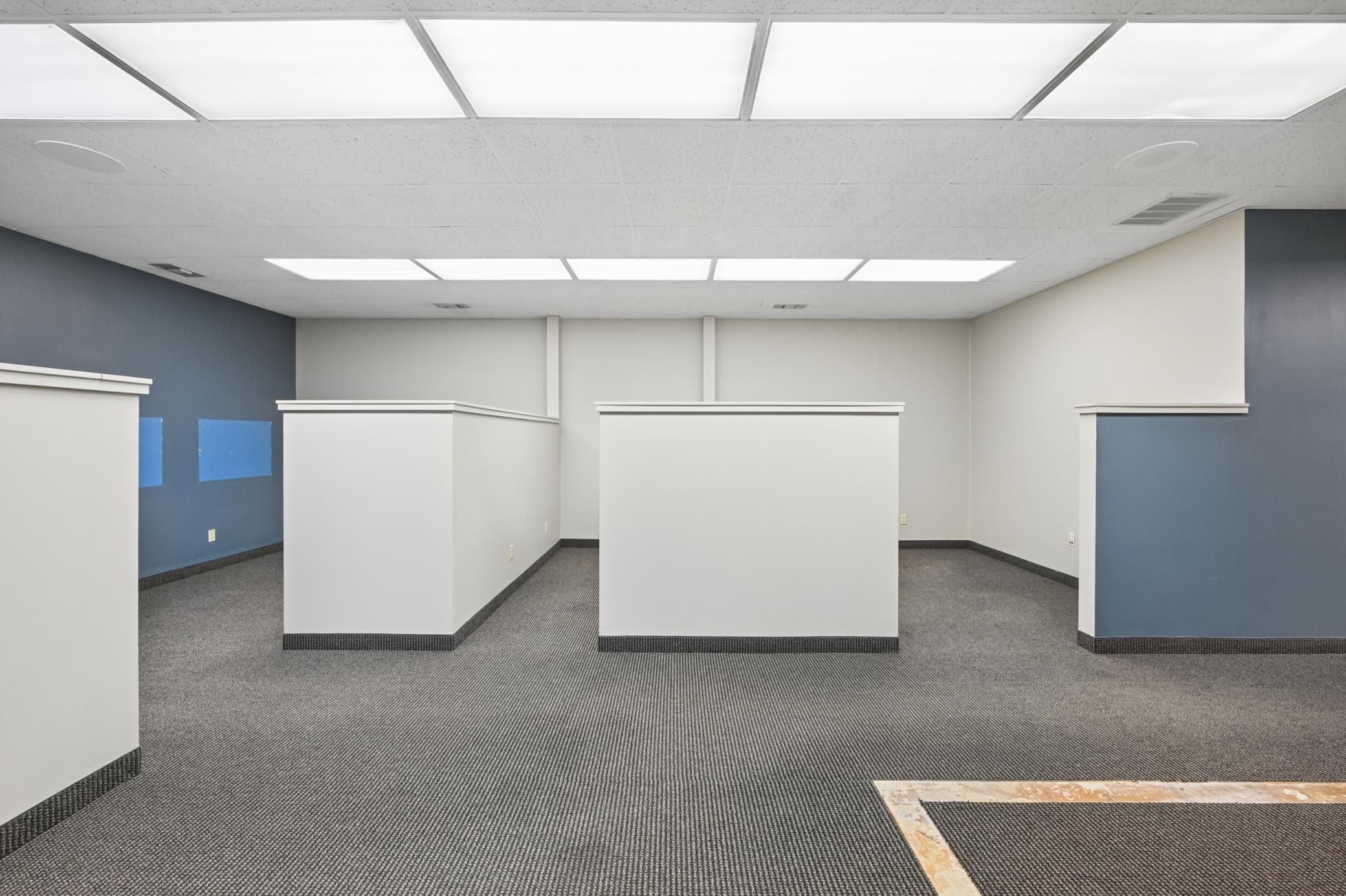 Another viewing showing a couple of the cube offices and supply or printer area.