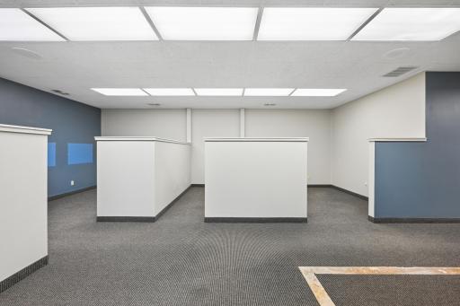 Another viewing showing a couple of the cube offices and supply or printer area.