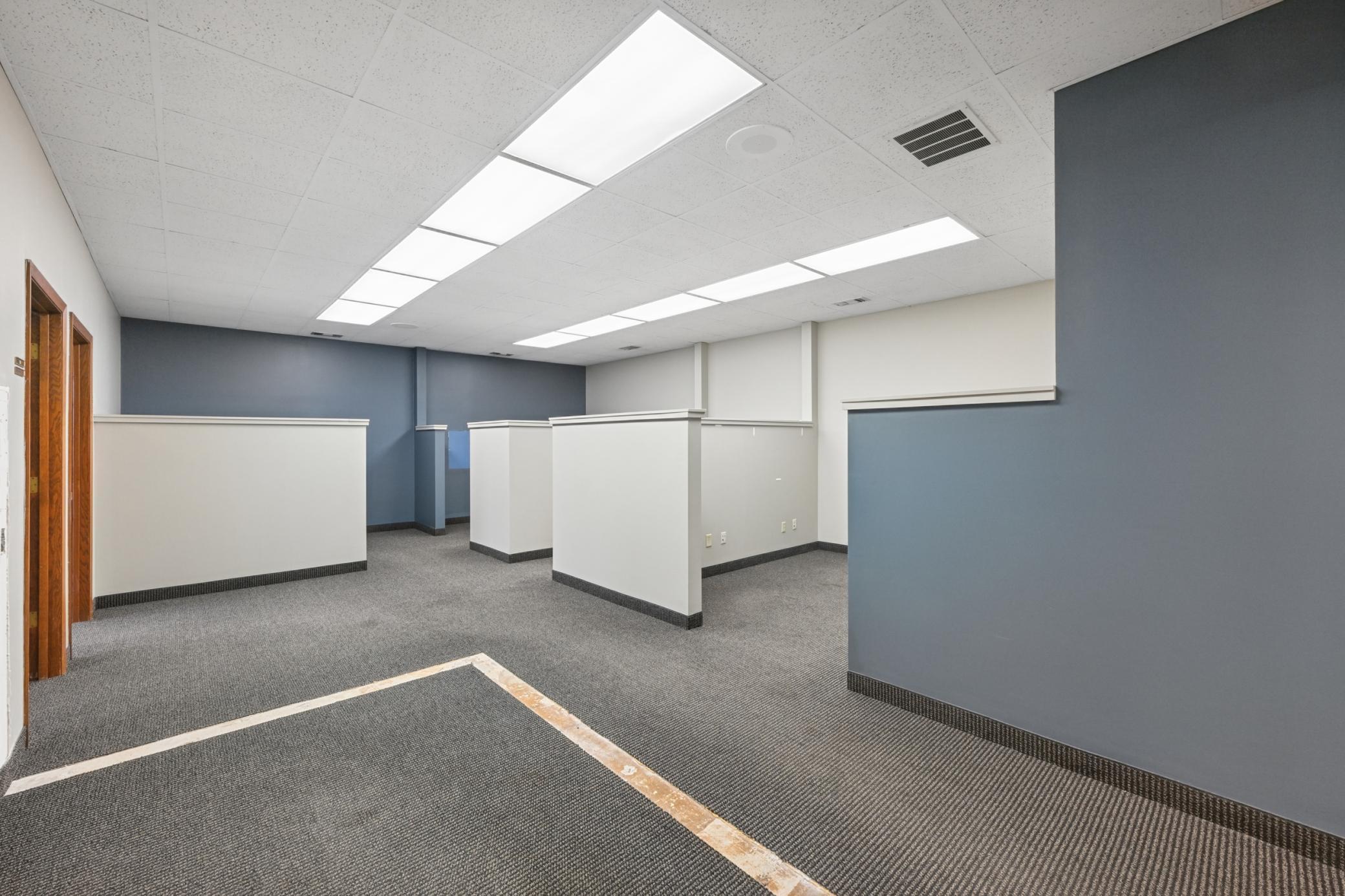 Front common area with 3 cubes and supply cube and two private offices.