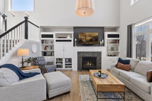 The kitchen opens to the two-story family room, which provides a warm and inviting place to relax. The gas fireplace is perfect for chilly evenings.