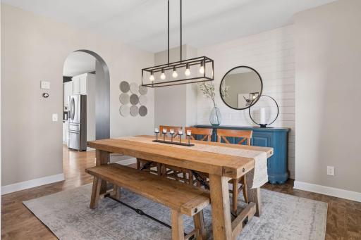 The formal dining room connects to the kitchen and is perfect for hosting. Lighting has been upgraded throughout most of the home, and it features custom window treatments throughout.