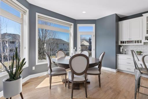 The informal dining area is perfect for casual meals with views of the backyard. The informal dining area opens to the spacious deck.