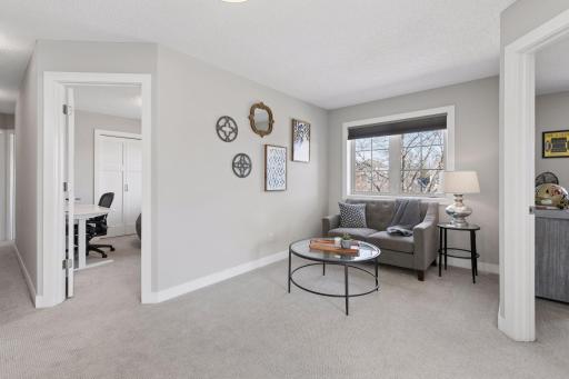 The loft upstairs is a cozy place to relax and read a book.