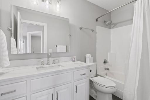 The second bathroom upstairs has also been remodeled and features granite countertops and tile floors.