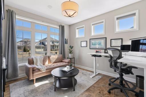 The main level office features glass French doors and creates a bright, beautiful space for working from home.