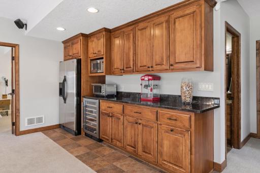There is a full-size refrigerator as well as a wine fridge in the dry bar in the lower level.