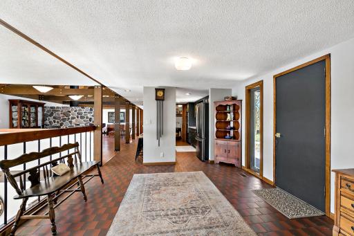 Enter the home into a huge tiled foyer area! The immediate view when entering is a wall of windows overlooking the lake!