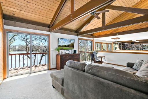 Main floor family room is open the other common areas. Notice the great beamed and vaulted ceilings!