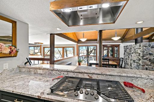 Imagine cooking while looking out at this peaceful tranquility! The open concept of this home is amazing. The entire main floor common area is open with walls of windows or patio doors along the entire back of the home!
