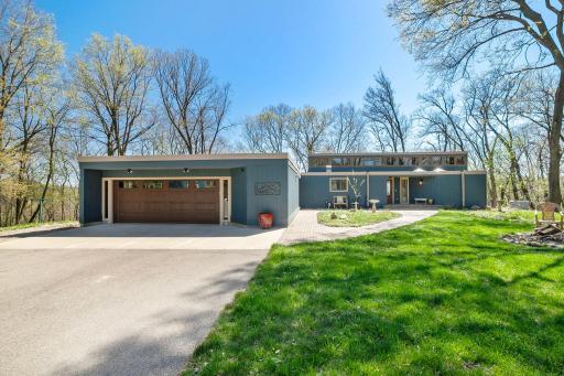 A 2 car oversized attached garage. Pavers lead to the 2 front entrances of the home