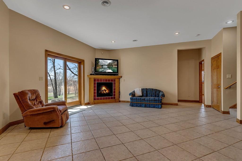 23 LL Family Room with gas fireplace, walkout to patio.jpg