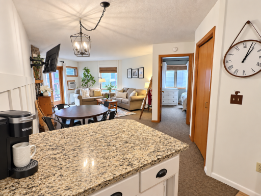 Eat in kitchen with 2 counter stools and Keurig.png