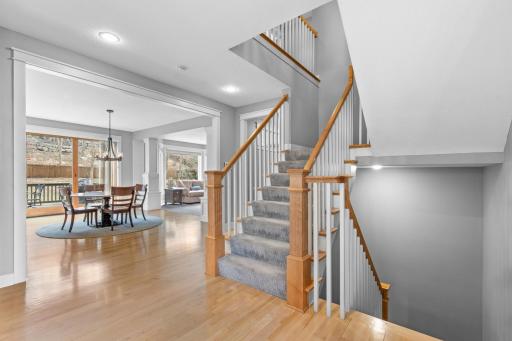 Freshly updated interior including painted cream trim, staircase, baseboards, and columns