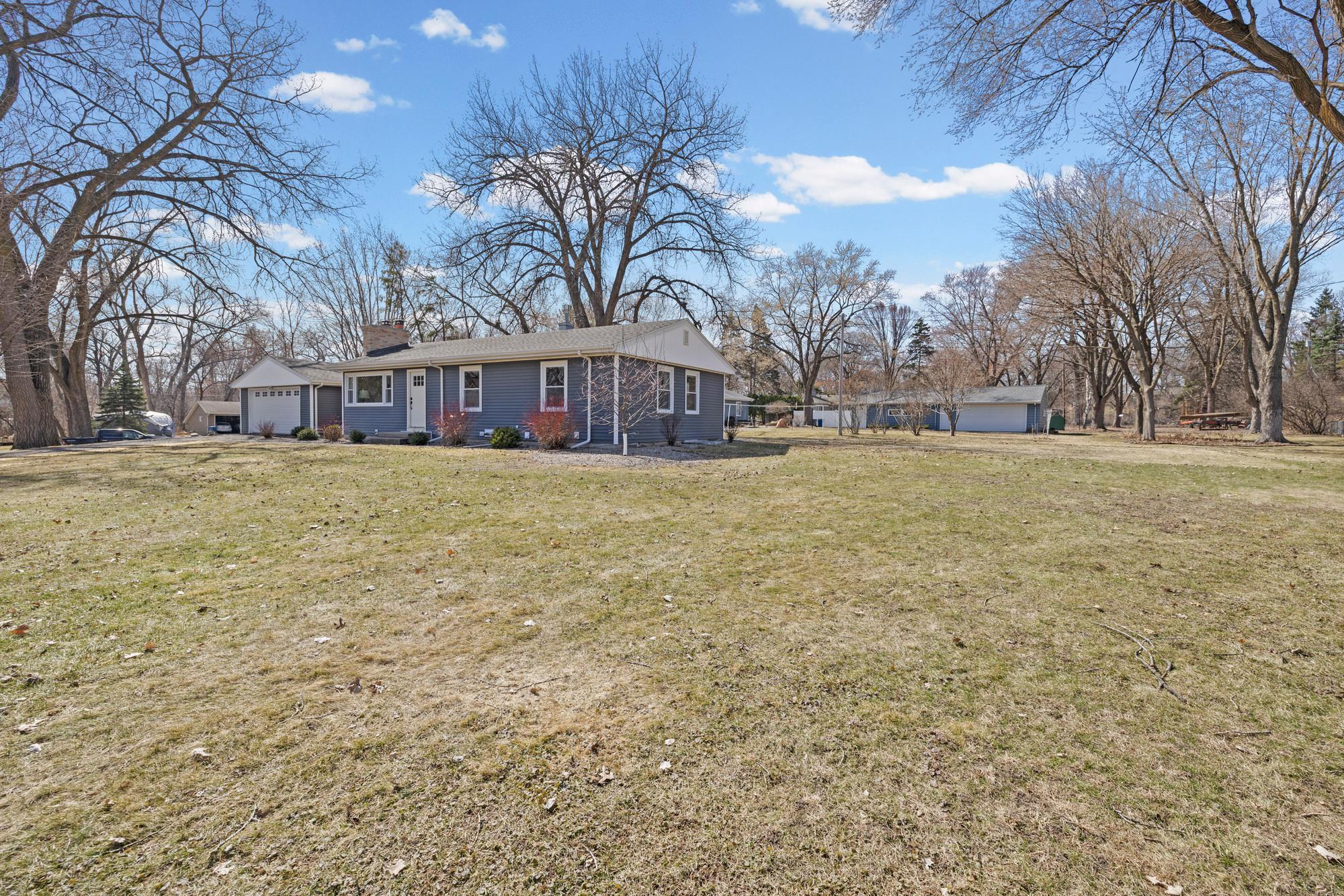 This yard space has been loved as a winter ice rink and summer wiffle ball field