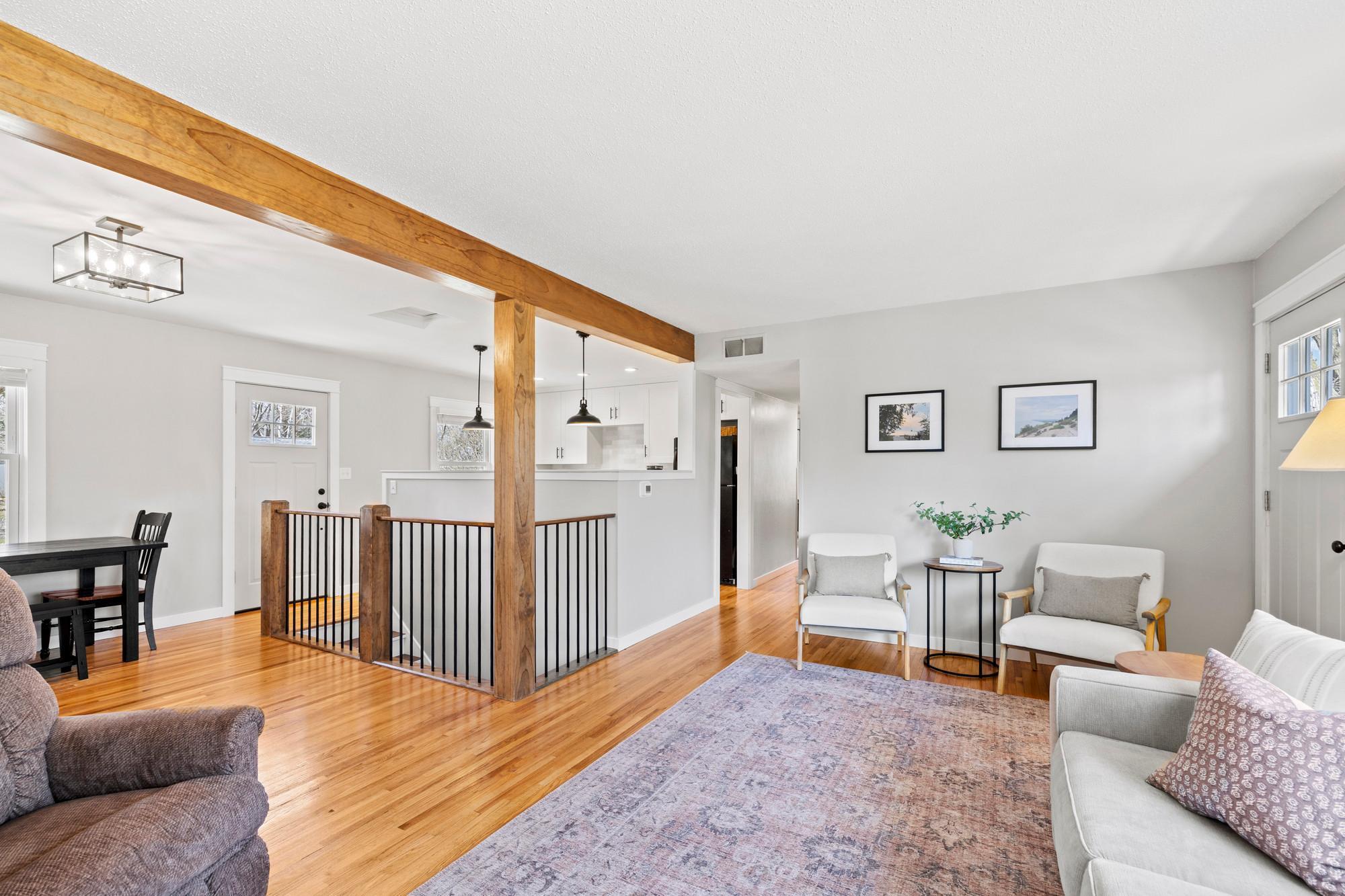 Refinished hardwood floors and open layout on the main level are functional and welcoming