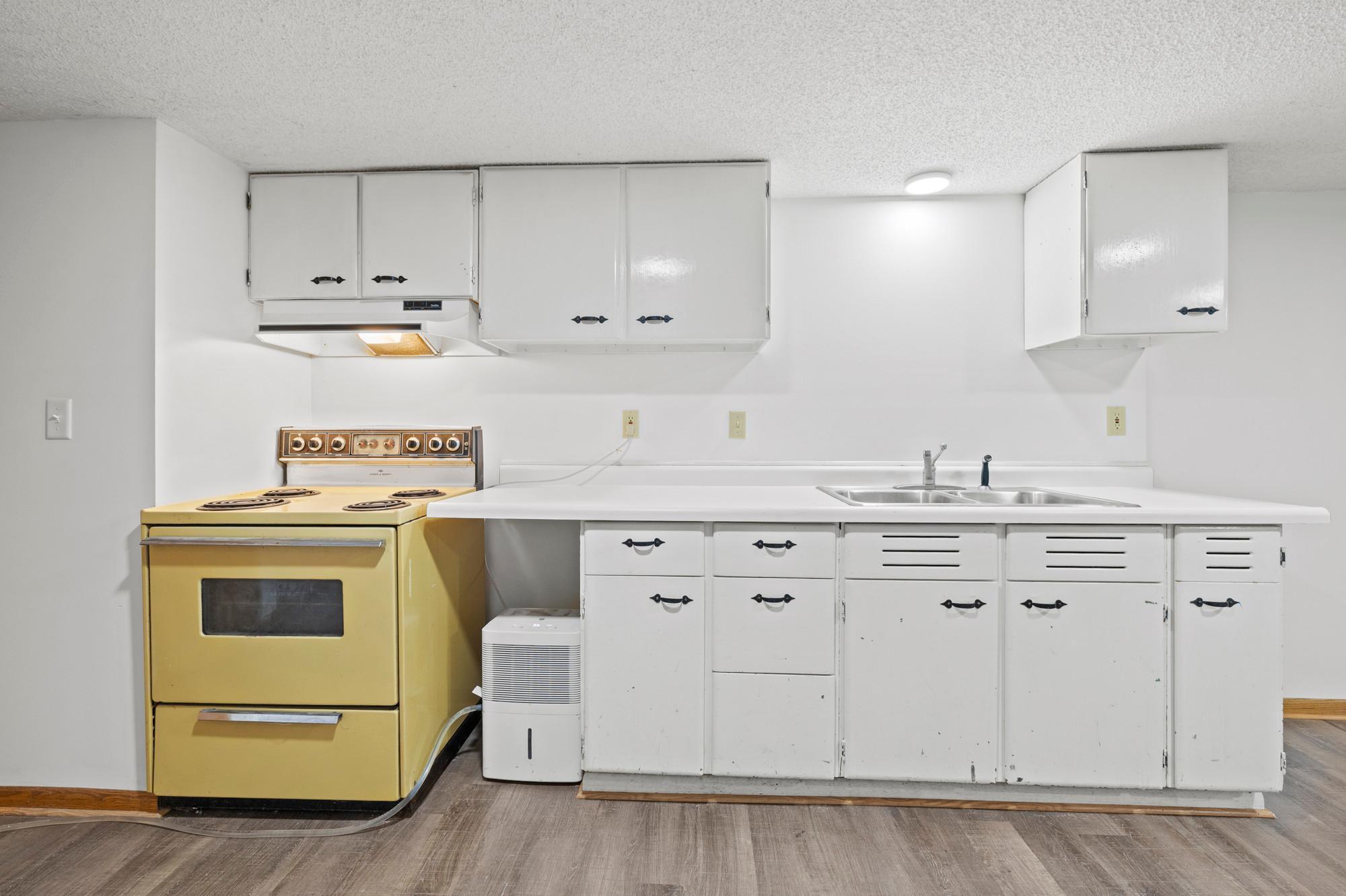 Basement kitchenette is not currently in use, but was fully functional as of current owners' inspection. Use as-is for a mother-in-law suite, or else plumbing is already in place for a new wet bar