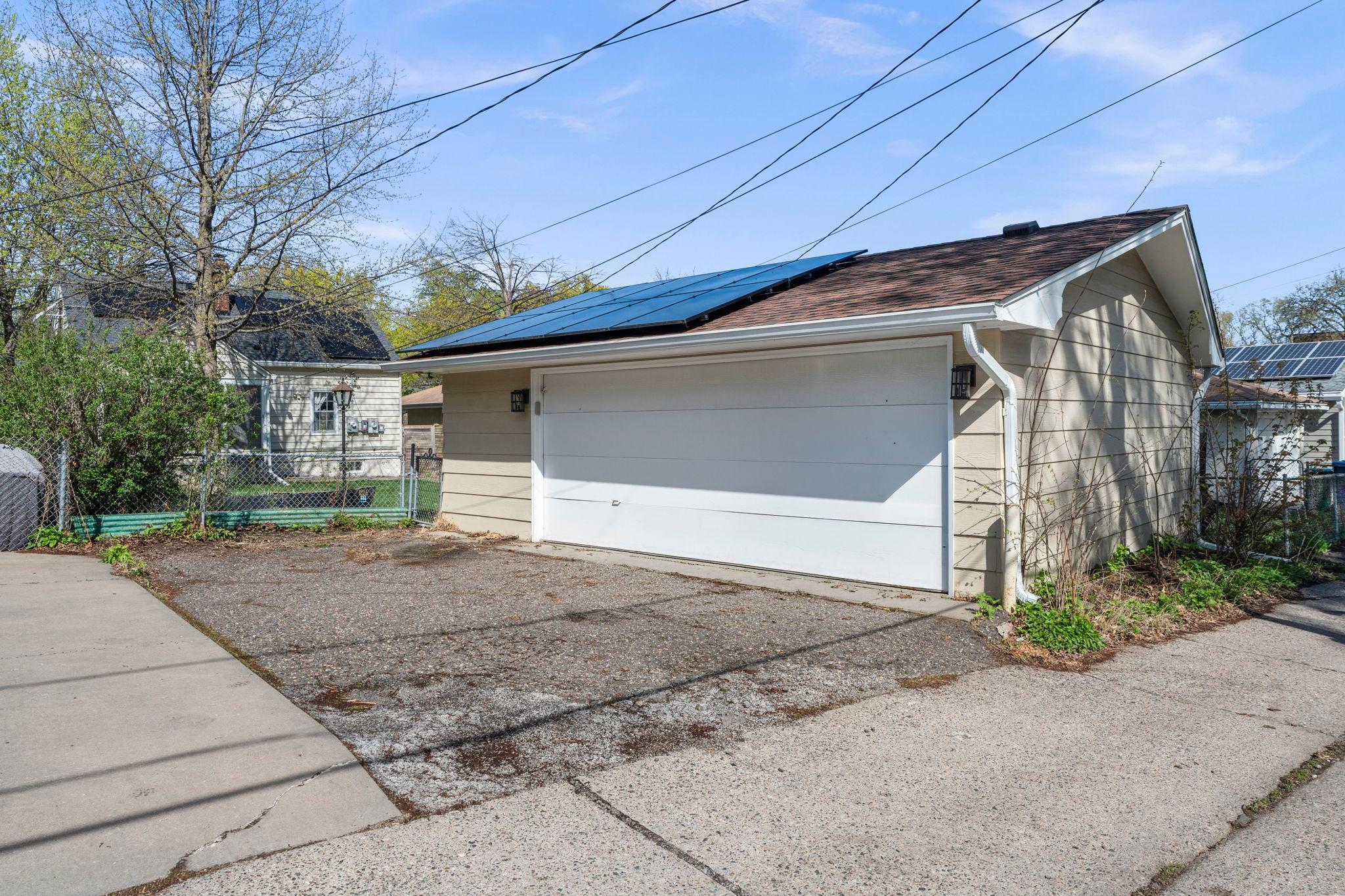 Large 2+ car garage with solar panels and EV charger ready!