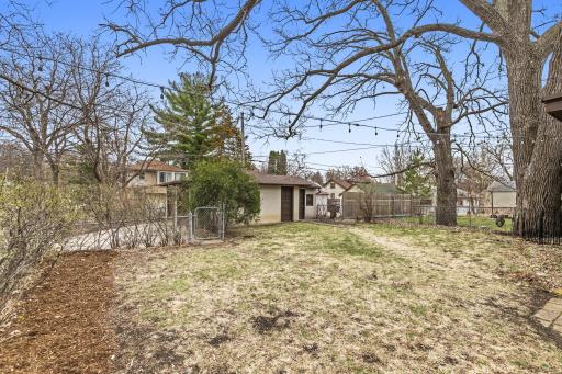 Back yard offers great space and easy access to garage.jpg