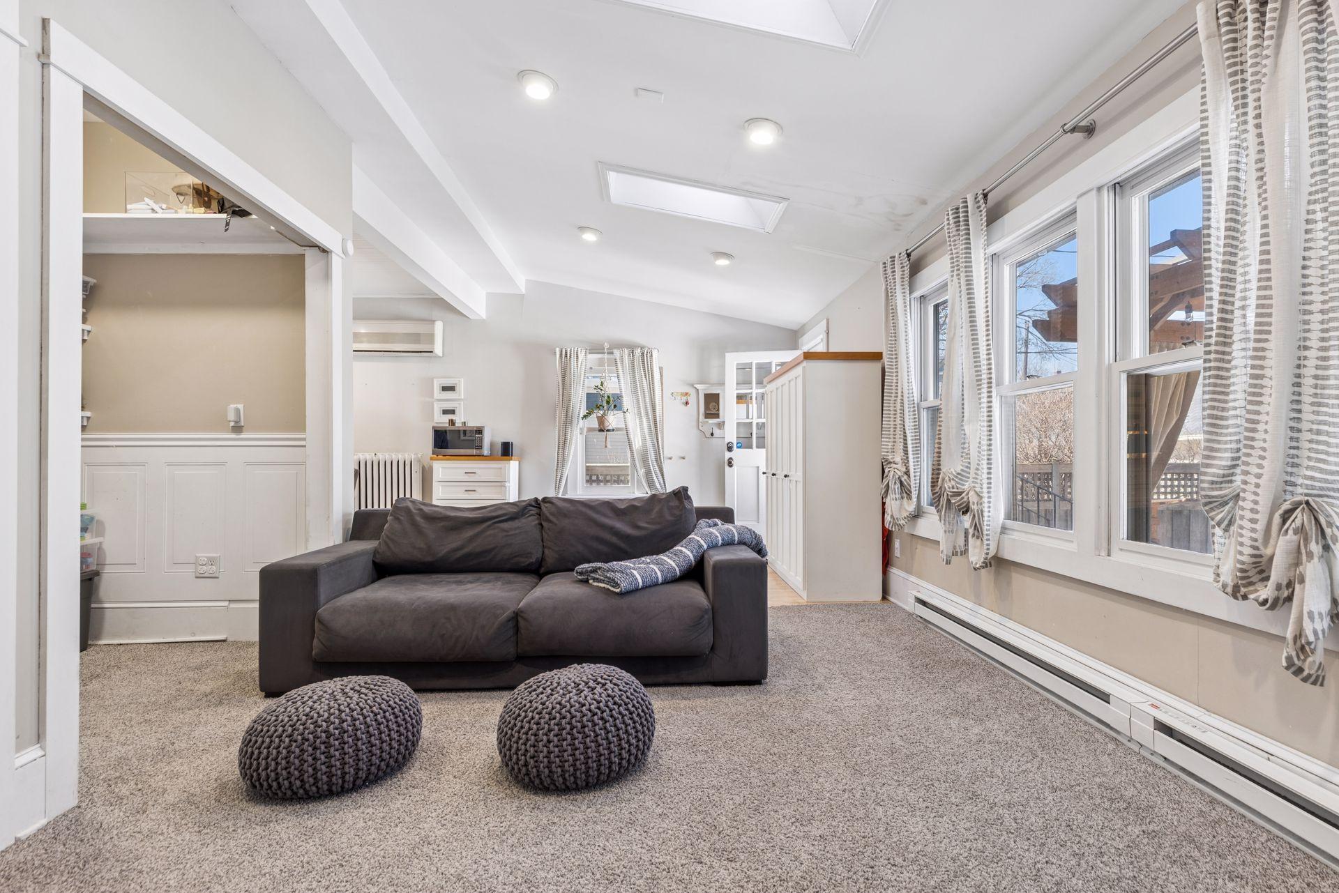 Family room features skylights with built-in blinds / recessed lighting