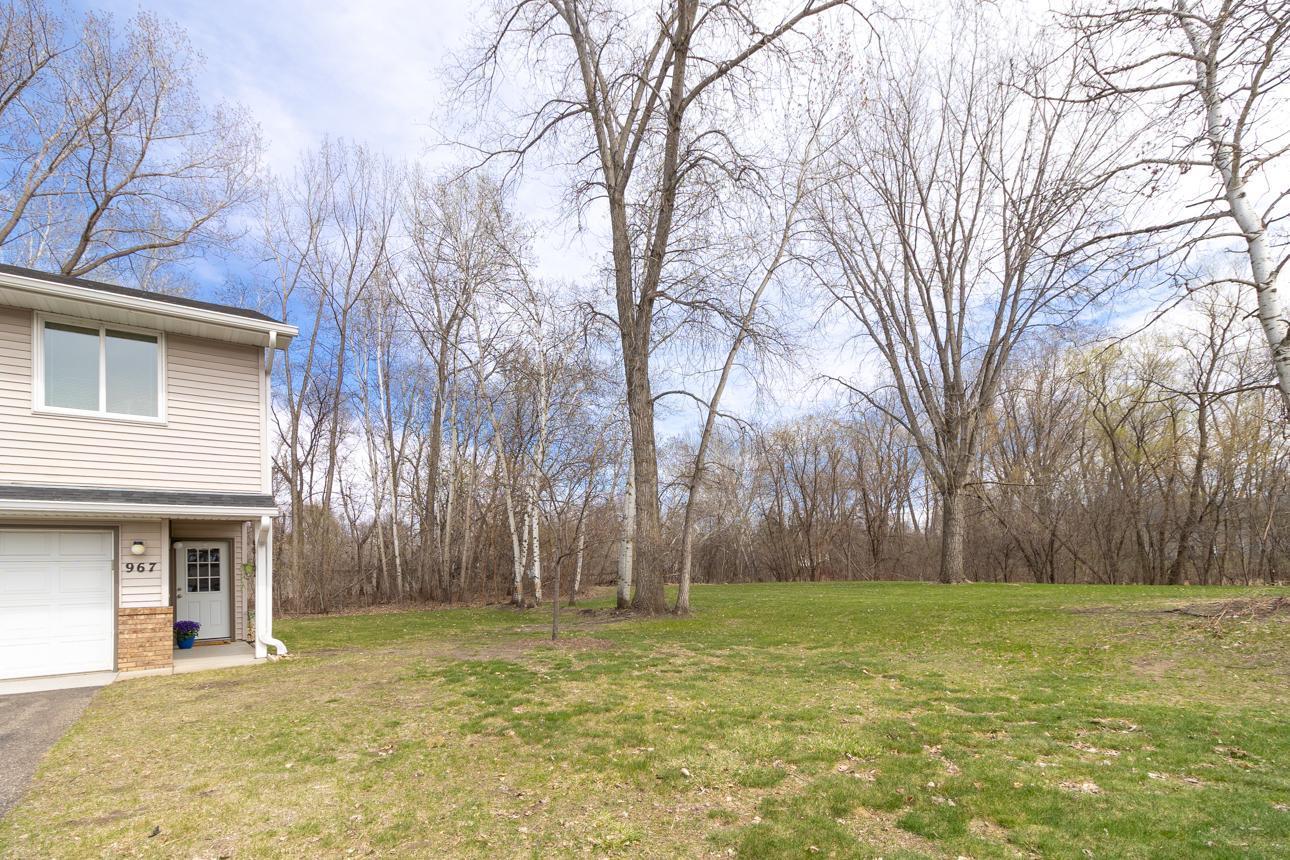 End unit provdes privacy and wooded views on two sides