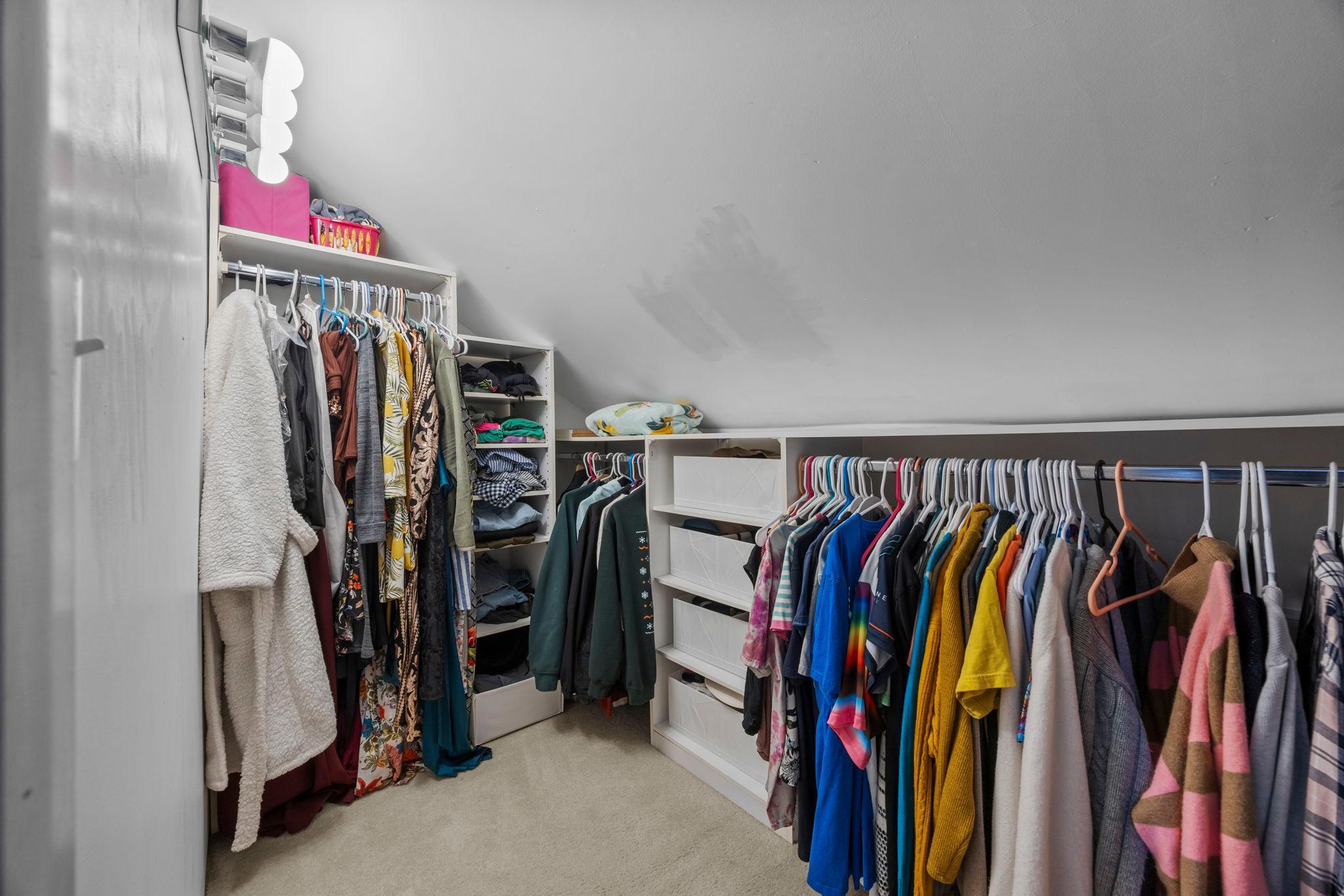 Primary walk-in closet. This home has great storage!