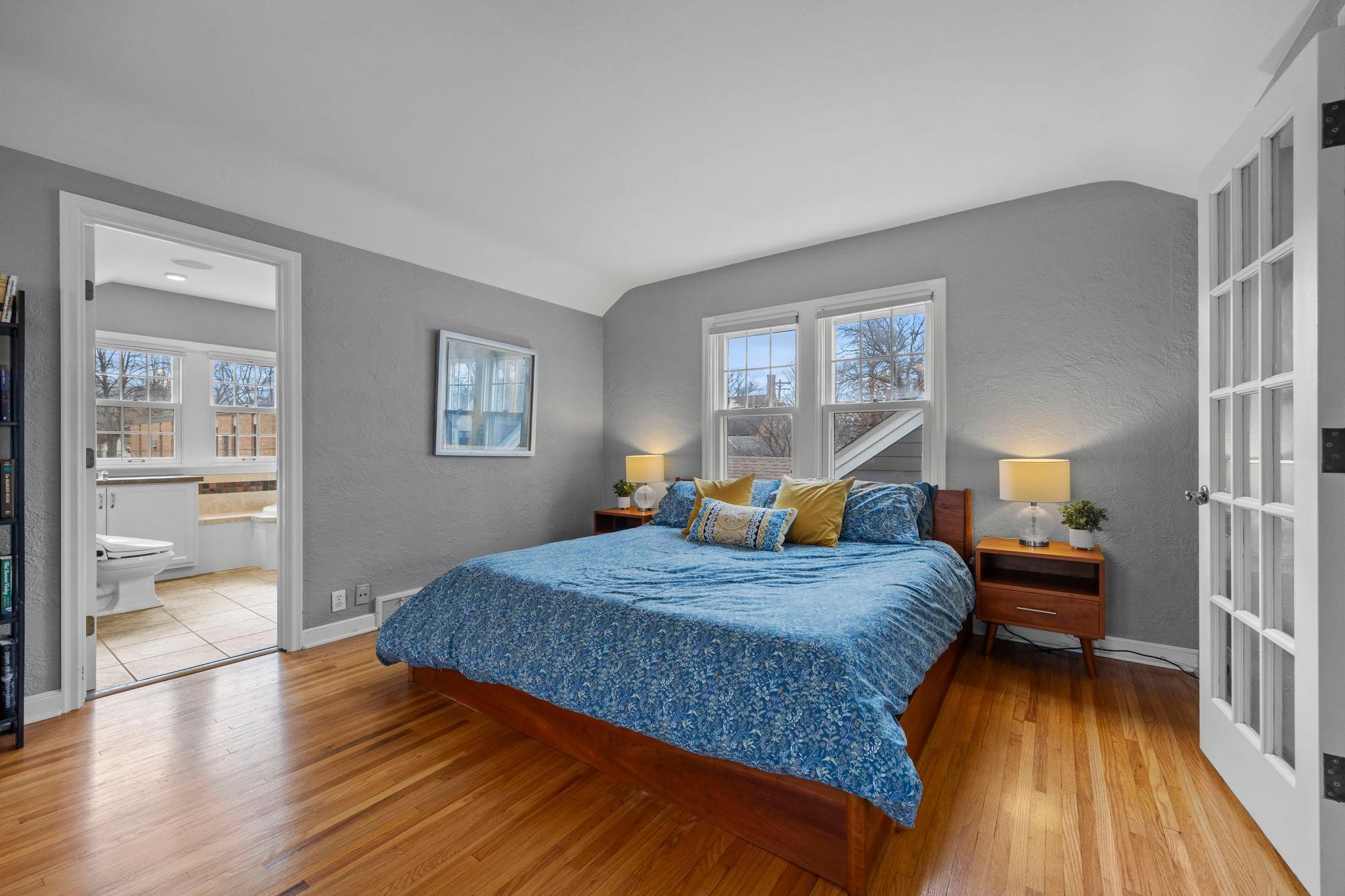Spacious primary bedroom with great ceiling height