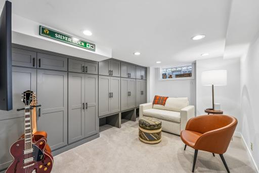 Fully finished Basement w/wall of storage cabinets