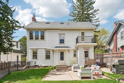 Back of house with large cement patio for entertaining