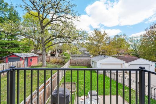 deck overlooking large backyard w/privacy fence on North & East side