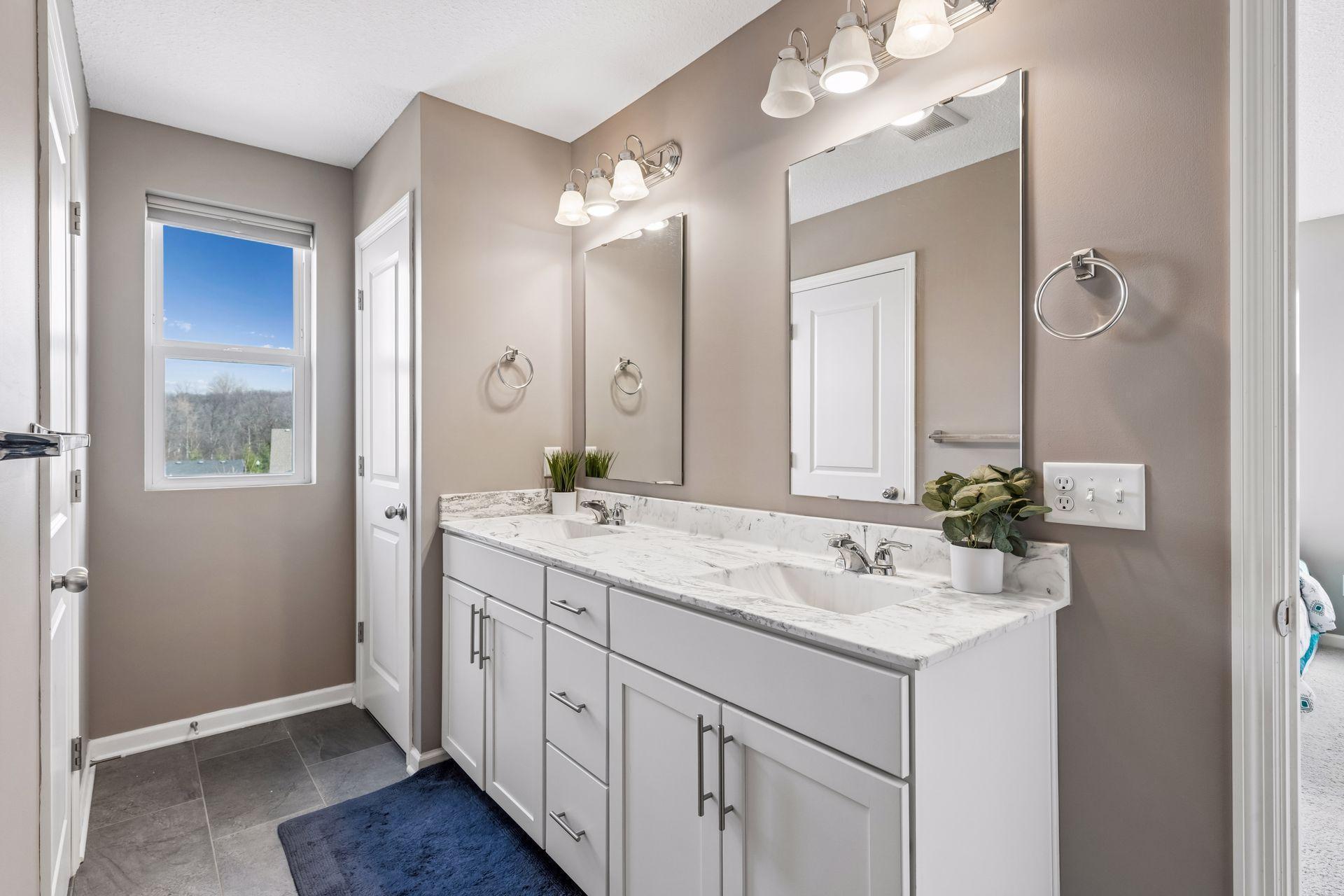 Primary bathroom also has additional linen closet