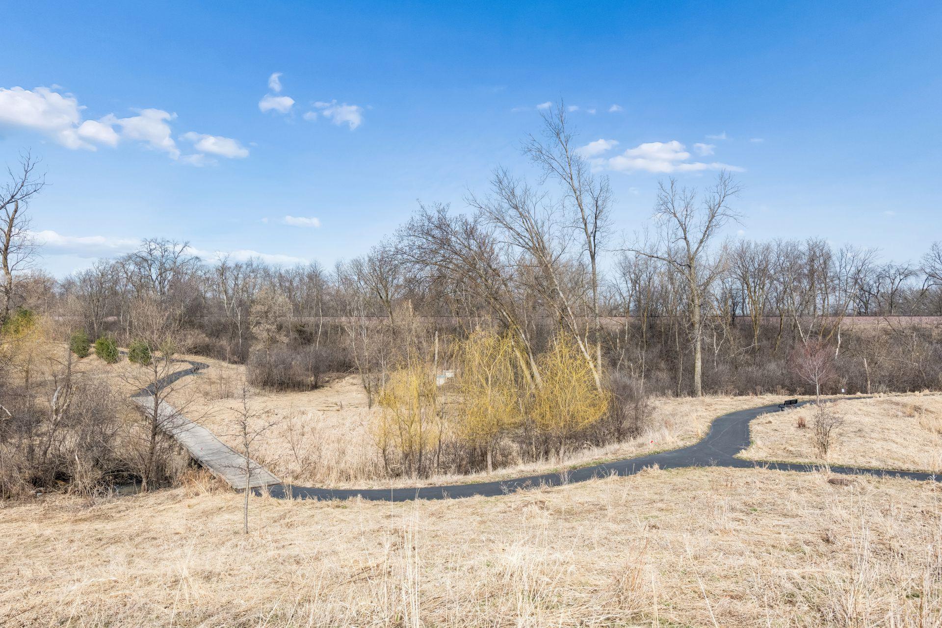 The pretty trails, woods and wetlands you see from the townhome