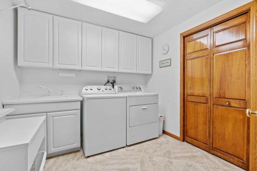 Bright laundry with great cabinet space