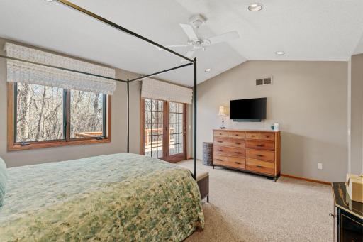 Primary bedroom features vaulted ceiling