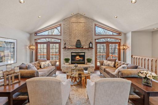 Open floor plan with vaulted ceiling in living room
