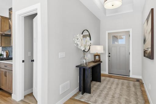 This spacious foyer offers a boxed ceiling.