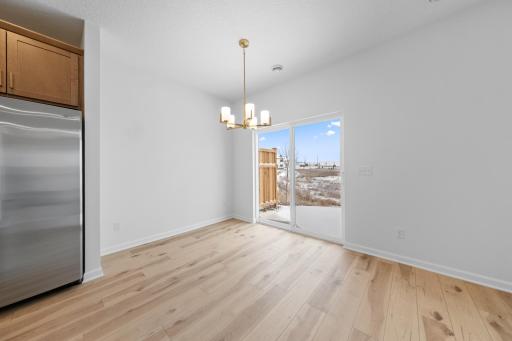 Dining Room features gold light fixture - for illustrative purposes only