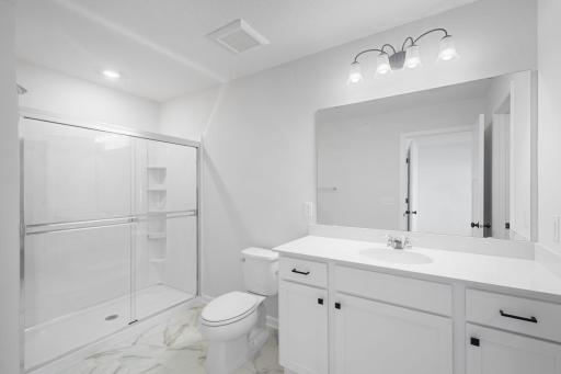 Owner's Bathroom features white cabinets, black hardware, fixtures, and shower door - for illustrative purposes only
