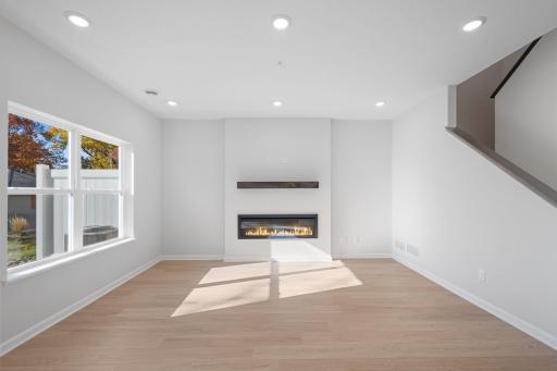 Living Room features electric fireplace and blinds - for illustrative purposes only