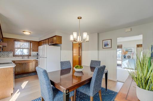 The inviting kitchen flows seamlessly into the dining area, ideal for daily living and easy hosting.