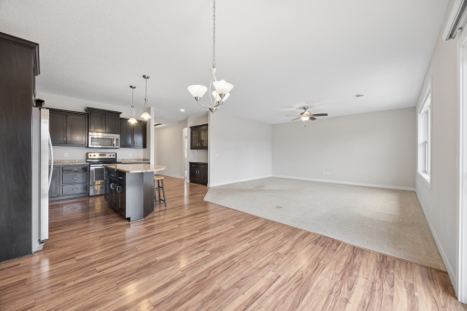 Open and spacious, Dining Kit Liv Room. This listing features a spacious layout, abundant natural light, and hardwood flooring throughout the living area.