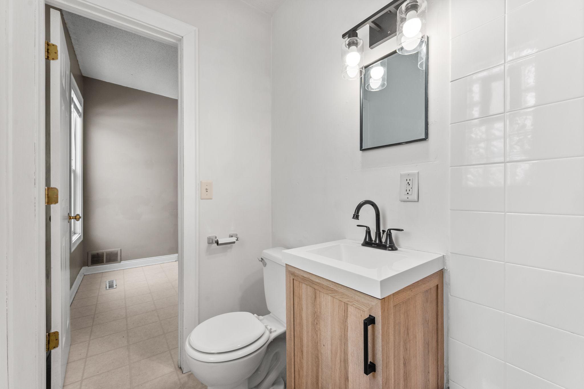 Back unit bathroom with new vanity