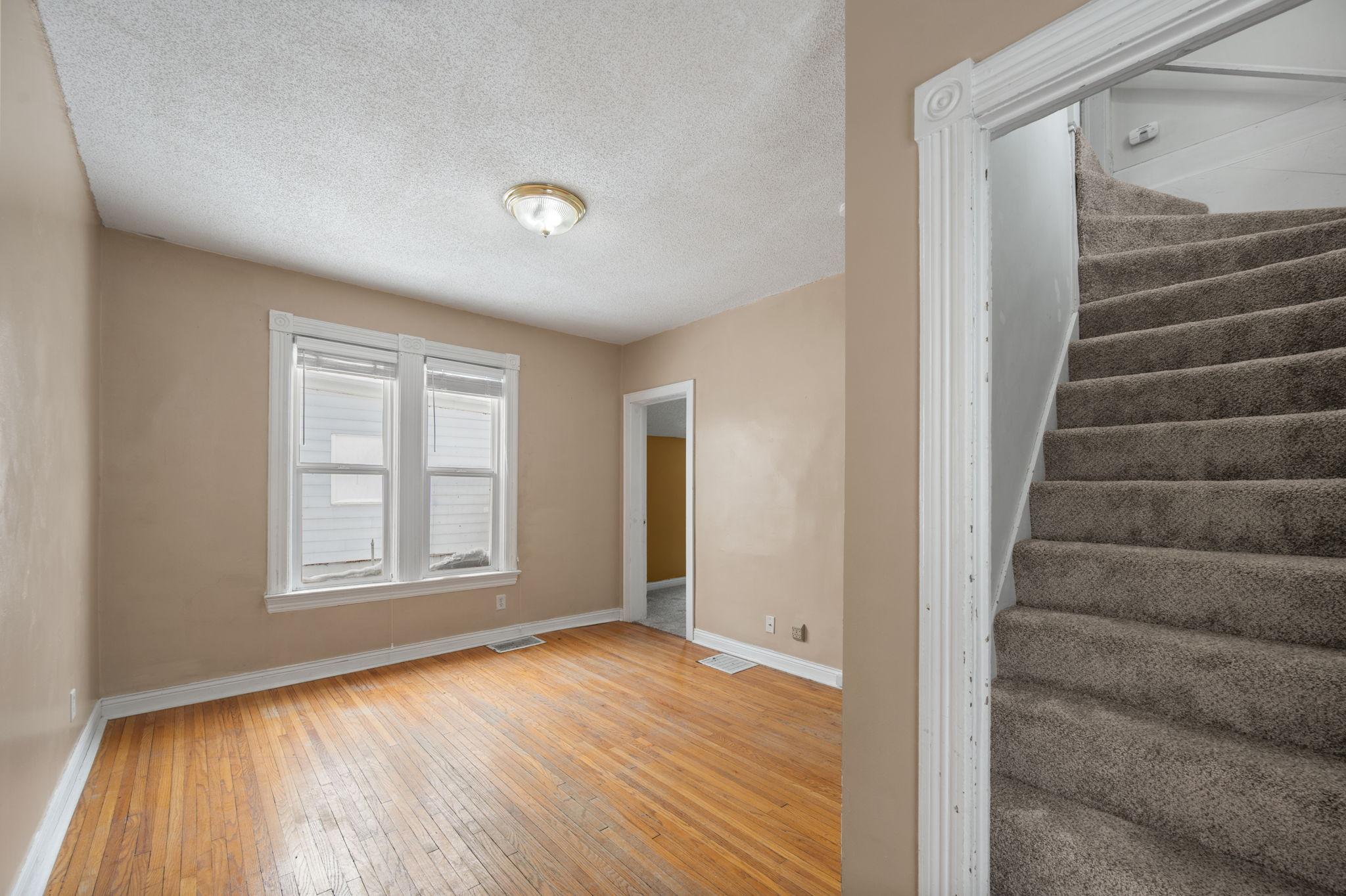 Staircase leads to the upper level bedroom
