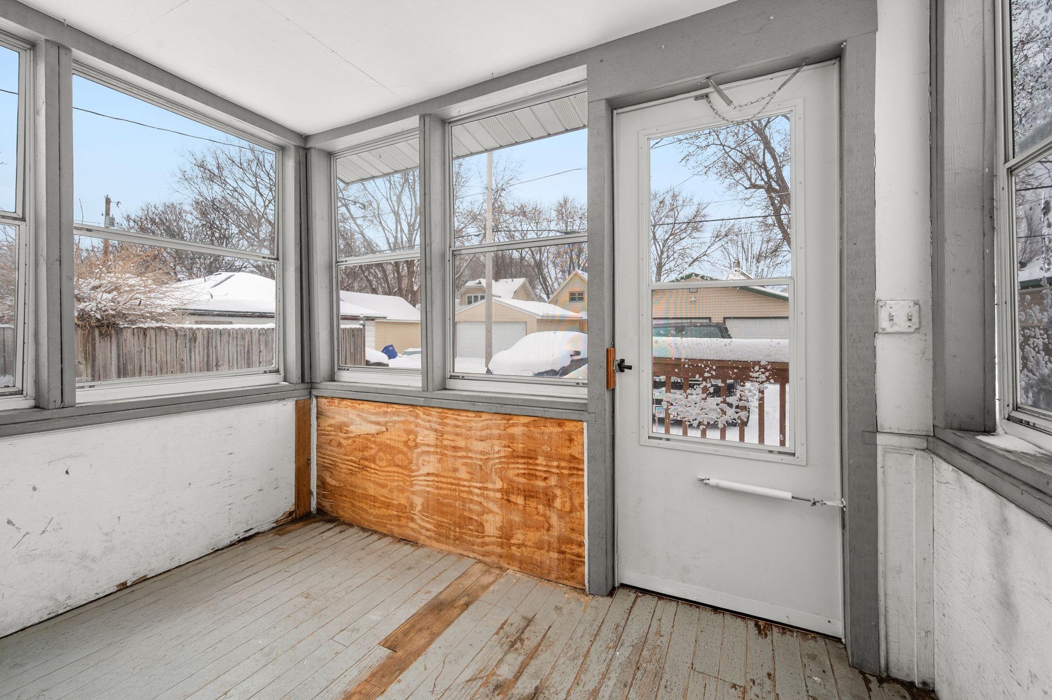 Back unit entrance from the parking pad in the back of the home