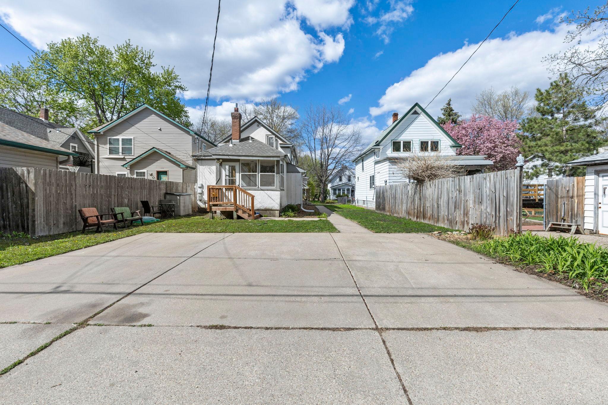 Parking pad serves both units. Rear entry to Unit 2 features new wooden stairs for convenient access