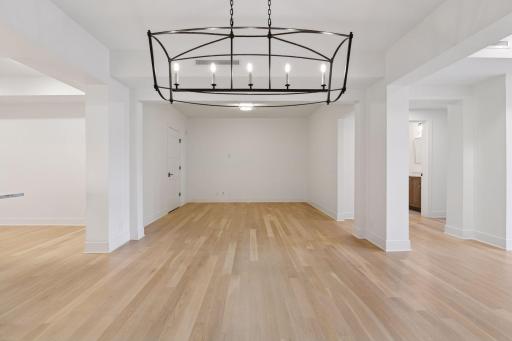 The dining area is designed with an open layout that seamlessly connects to the living and kitchen areas
