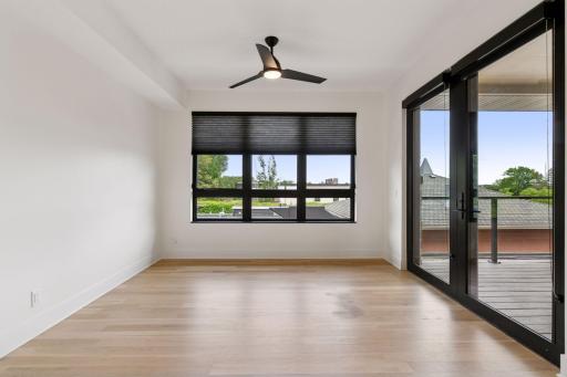 Sun room offers additional seating area and access to the private deck