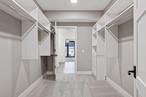 Large walk-in closet with built-in components to help you stay organized