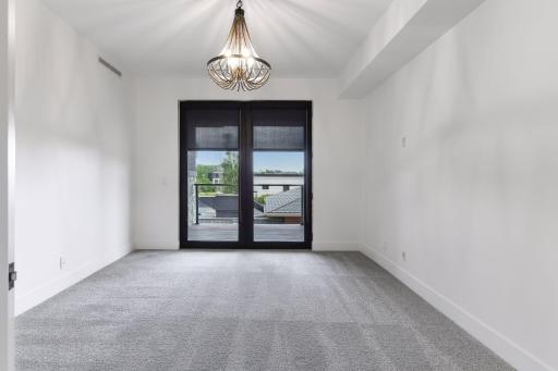Retreat to the luxurious primary suite at the end of the day with access to the deck.
