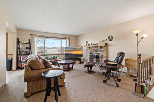 Upper-level living room with Chicago-brick wood-burning fireplace.